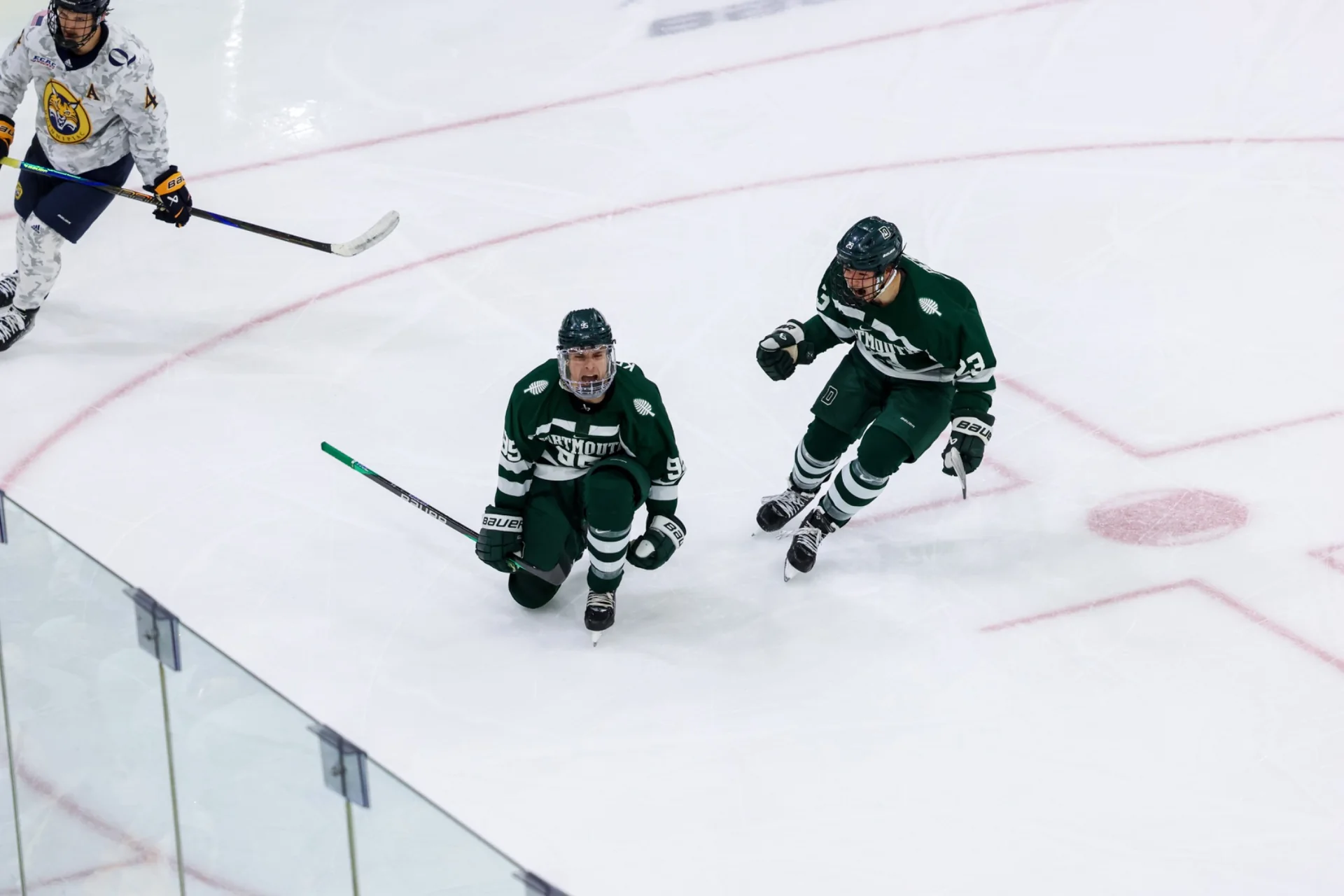 Hockey player wearing number 24 looking out over the ice