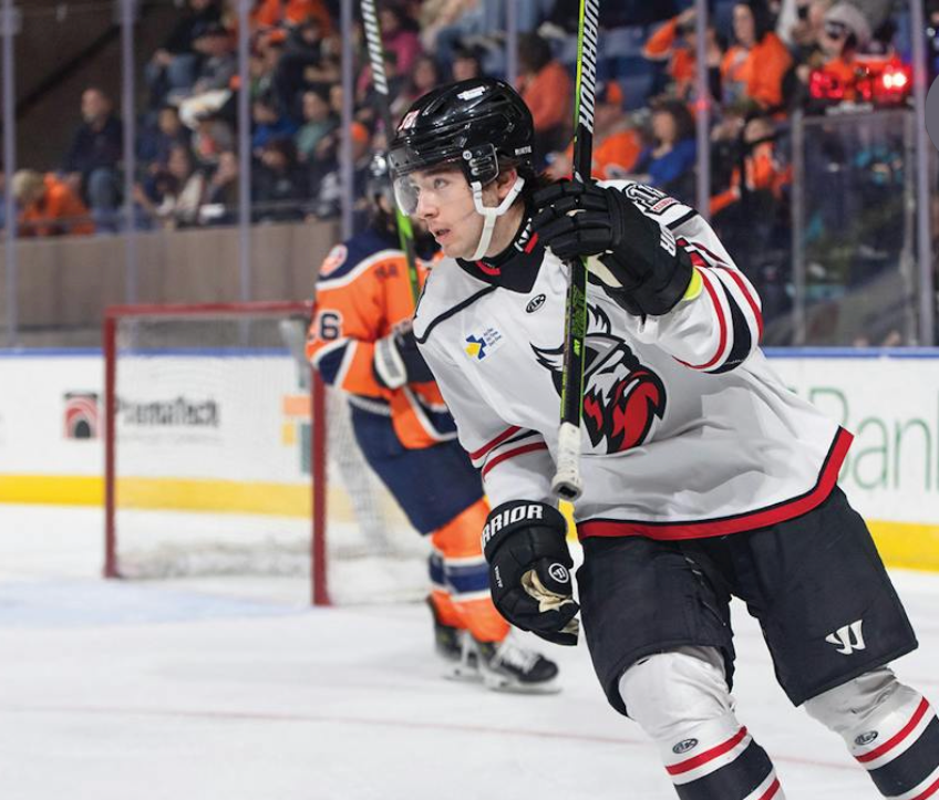 Hockey player driving through the ice